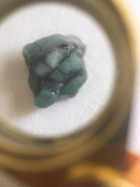 Close-up of an emerald, using a loupe