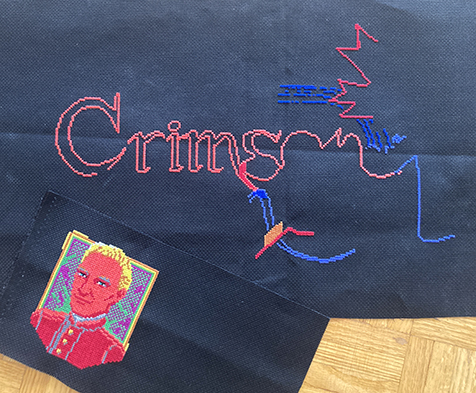 The Crimson Diamond logo cross-stitch