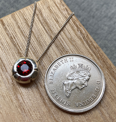 Silver charm to scale