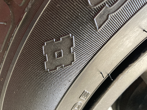 Sumitomo logo on a car tire