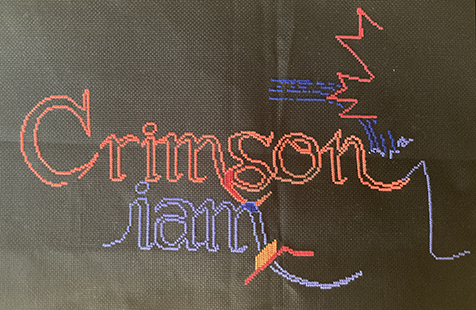 The Crimson Diamond logo cross-stitch work in progress